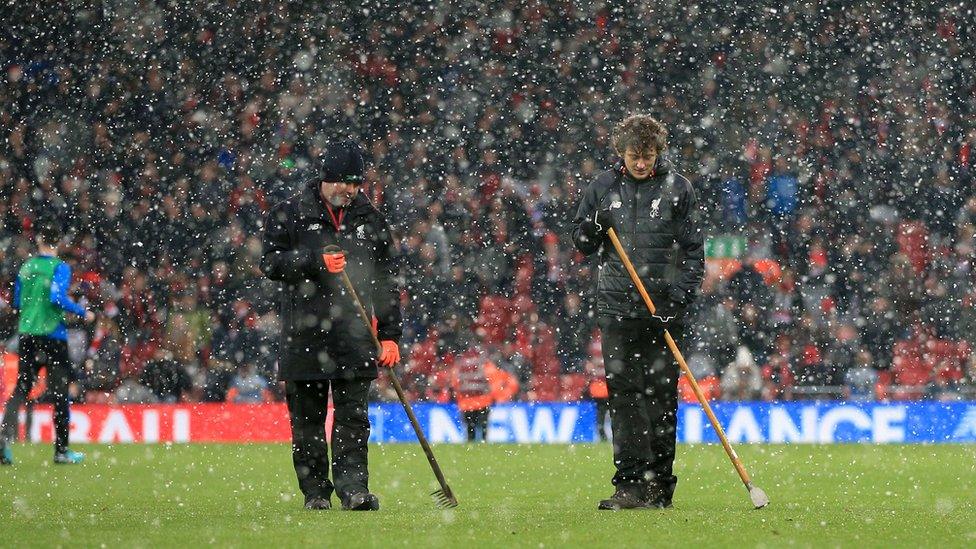 Ground staff at the Liverpool v Everton match