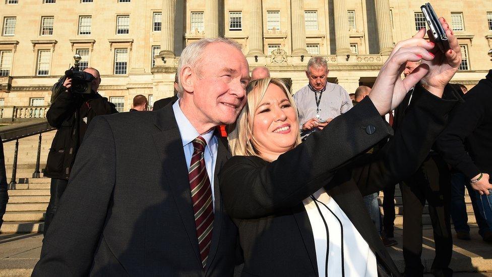 Sinn Fein's Stormont leader Michelle O'Neill takes a selfie with the late Martin McGuinness on the steps of Stormont in January 2017