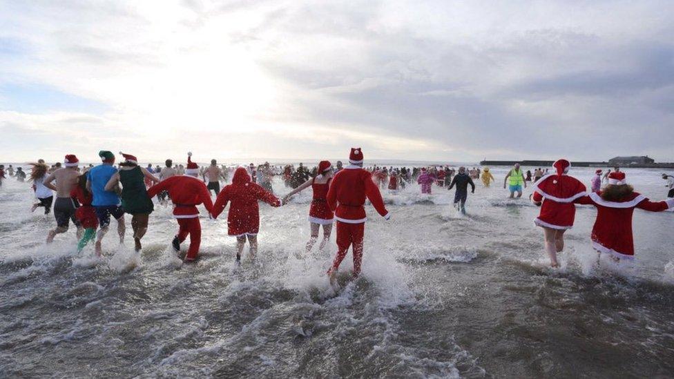 Swimmers running out to sea