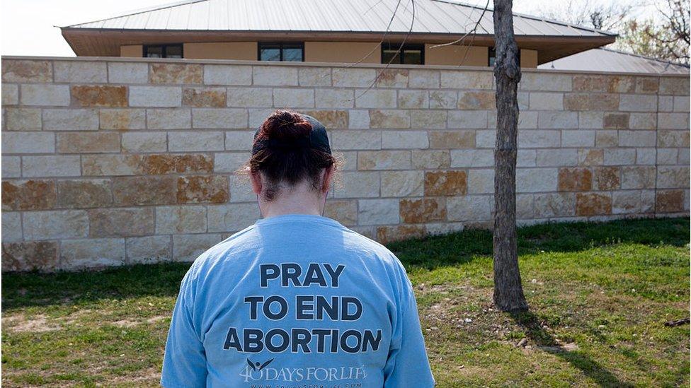 Anti-abortion activist prays outside Texas clinic in this file photo