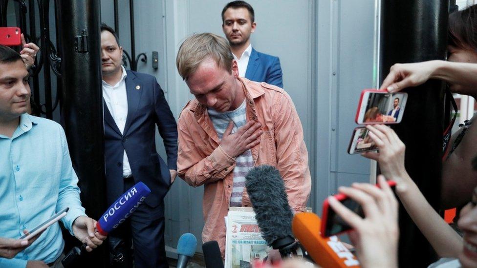 Russian journalist Golunov walks out of the city office of criminal investigations in Moscow