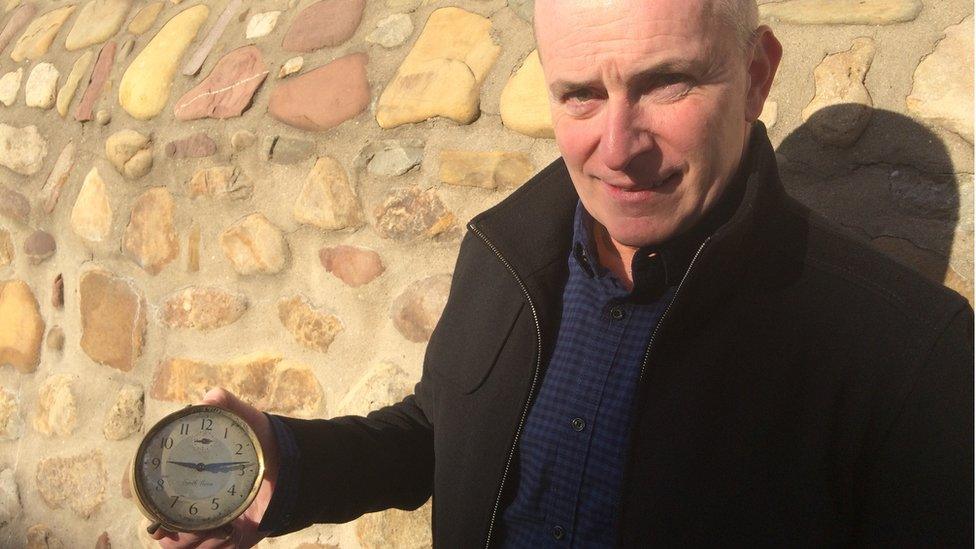 Mike Flynn with a clock his father - one of the rescuers at Aberfan - dug up.