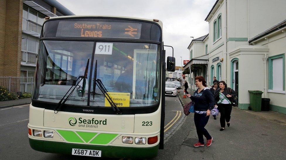 People board a rail replacement bus