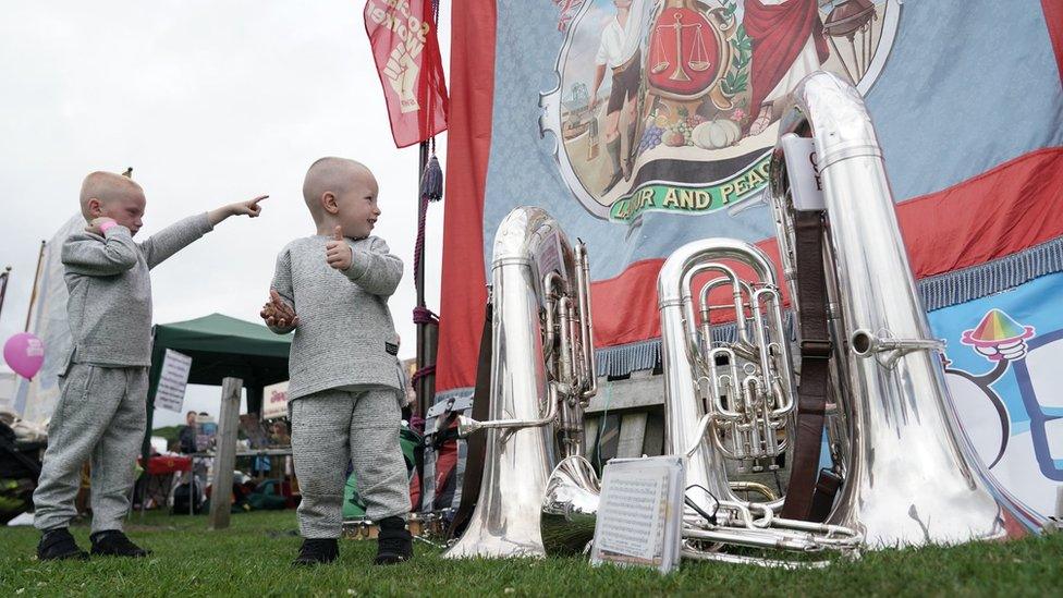 Two boys look at a banner during the Durham Miners" Gala.