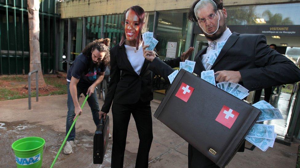 Anti-corruption activists acting in front of Brazilian Congress. 7 May 2016