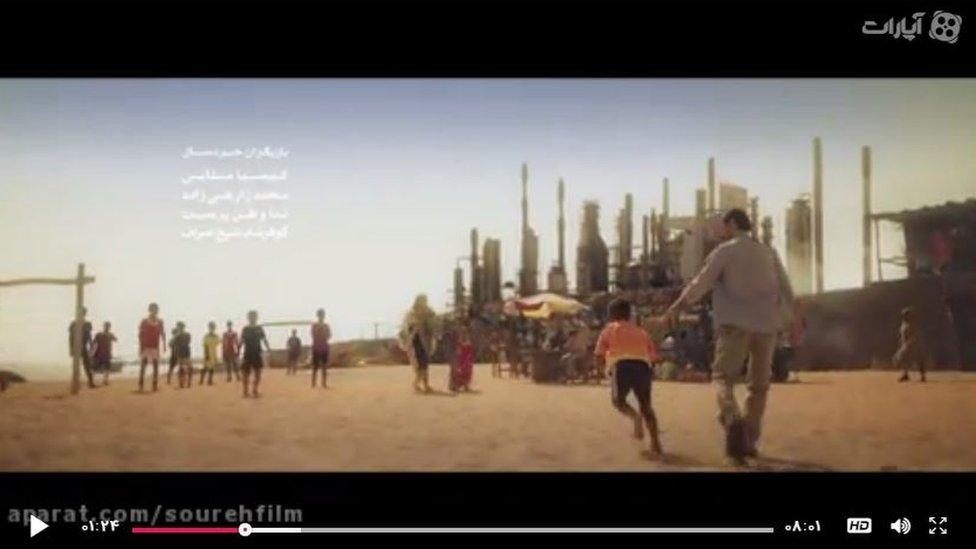 Children playing on beach by nuclear power station