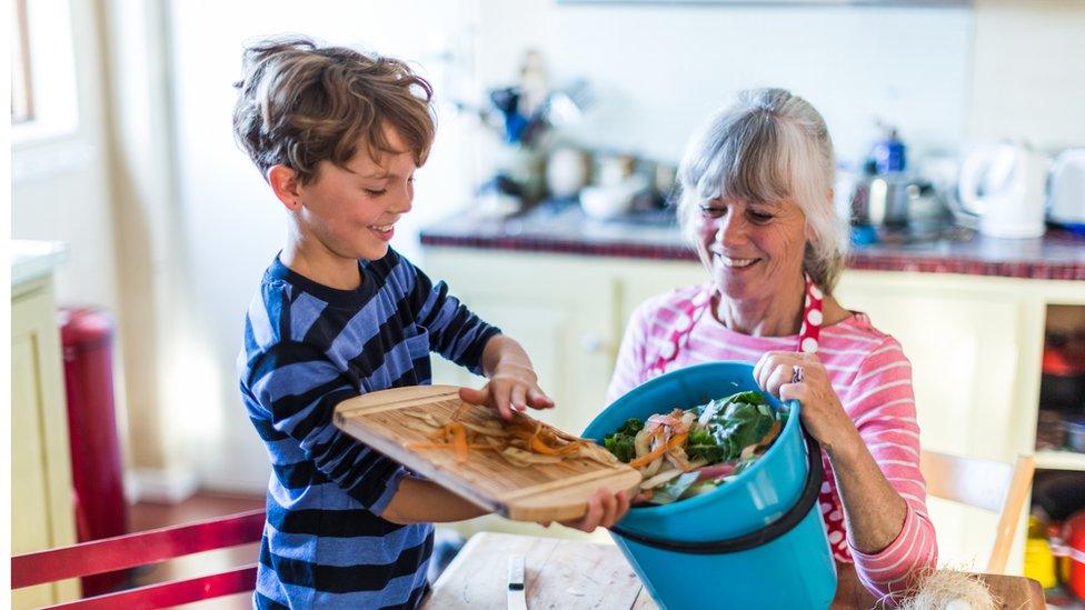 child-composting-with-grandmother