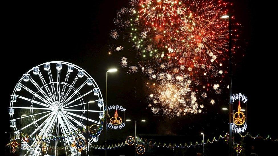 Fireworks explode near the Wheel of Light during Diwali celebrations in Leicester