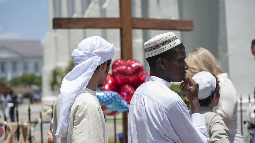 2015-06-21. Members of the muslim community of Charleston paid their respects at Emanuel AME Church on Sunday evening. Colm O'Molloy for BBC News.