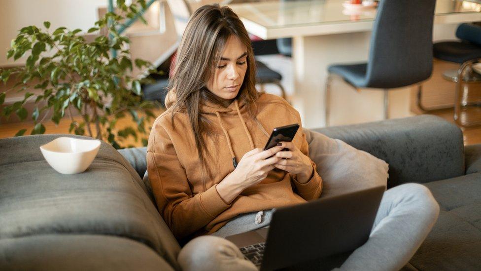 Young woman looking at mobile phone