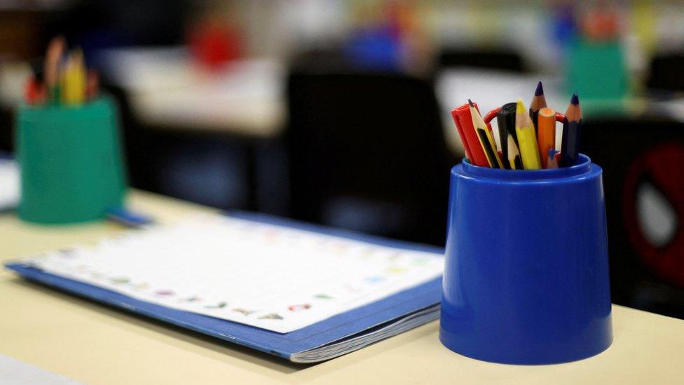 Pencils are pictured in an empty classroom