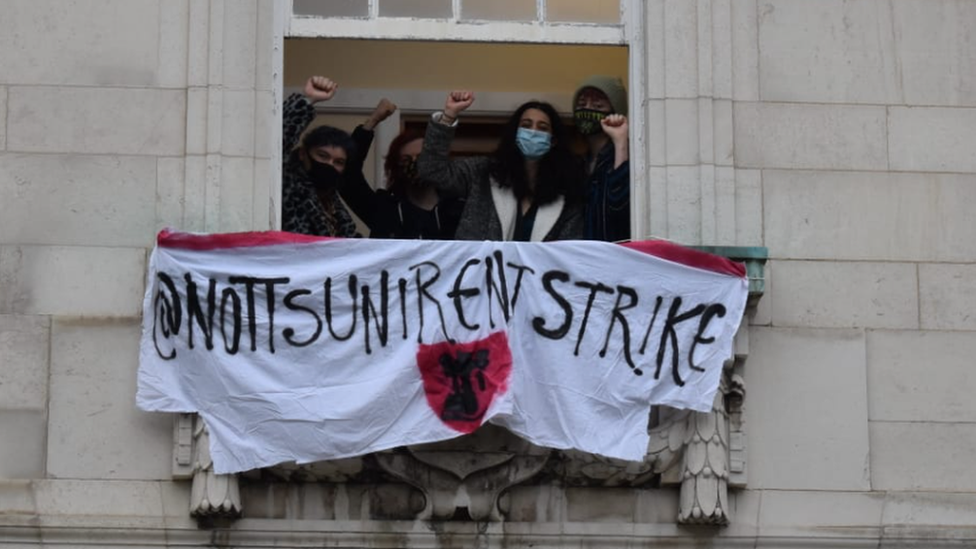 Students protest with banner