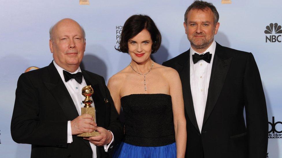 Julian Fellowes with actors Elizabeth McGovern and Hugh Bonneville at the 2012 Golden Globes