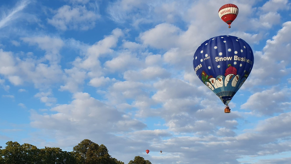 Two hot air balloons flying in the sky