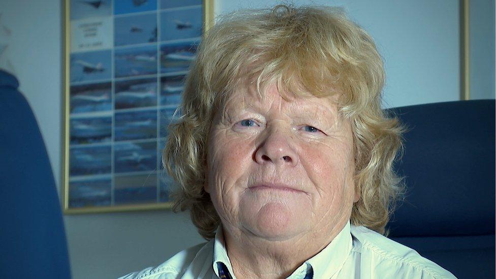 A women with ginger hair in a shirt