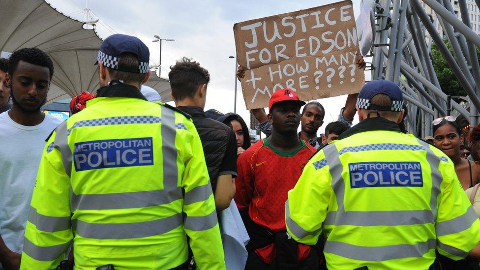 Protesters confront police