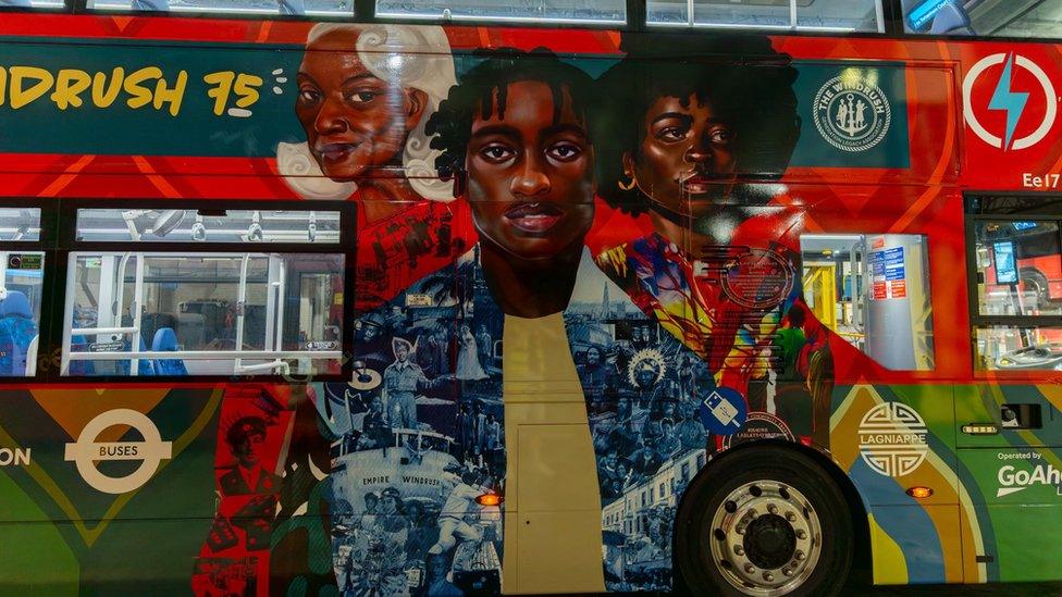 A double-decker bus depicting an older person and two younger people in a colourful background.