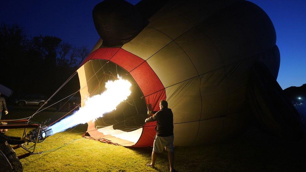 A hot air balloon having heat poured into it