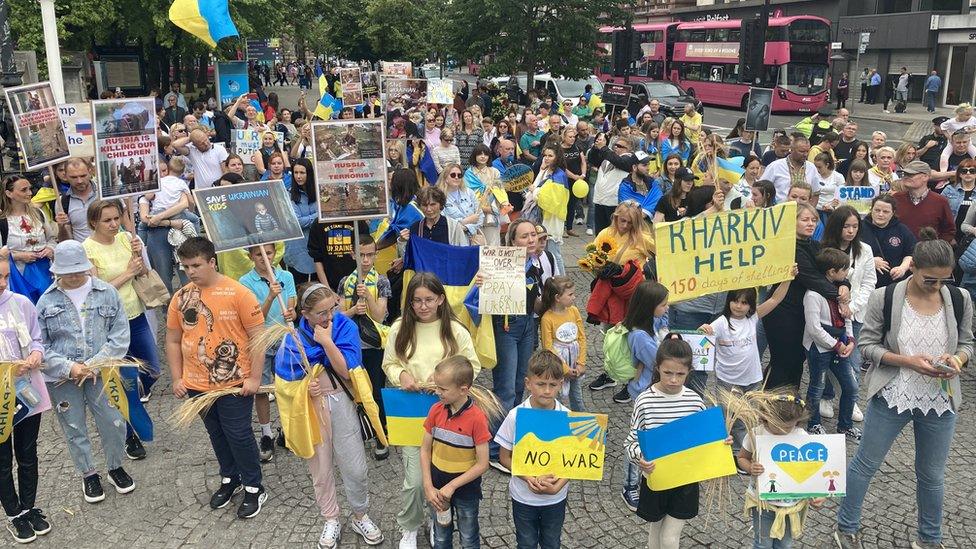 Demonstrators gathered outside city hall