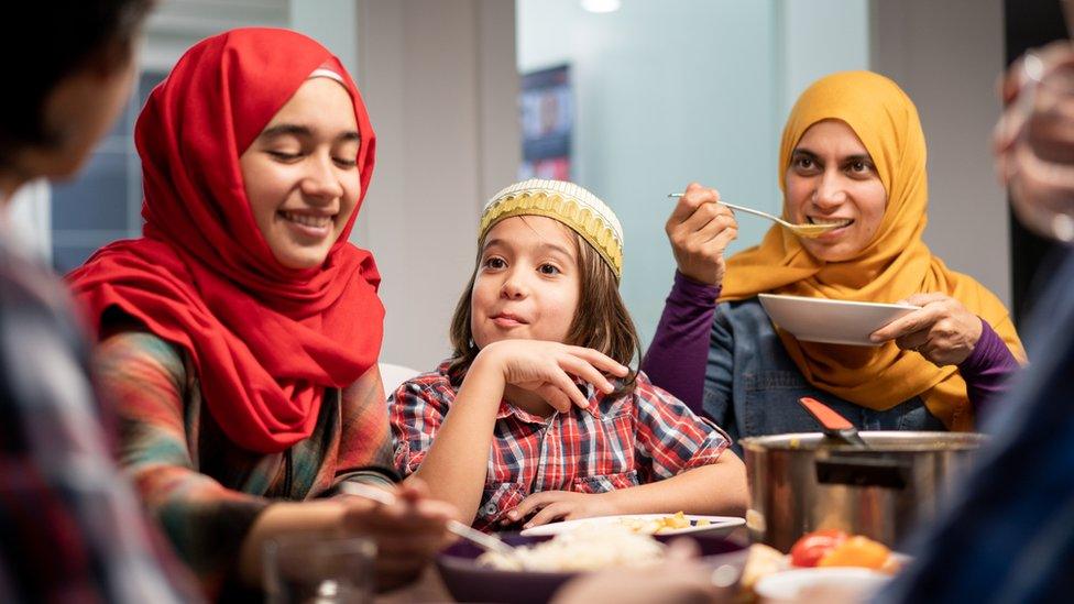 Family eating Iftar and enjoying breaking of fasting