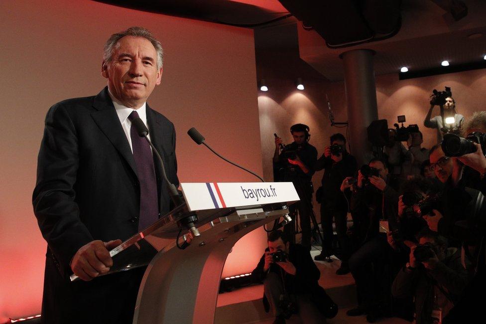 French centrist politician Francois Bayrou smiles before delivering his speech in Paris, 22 February