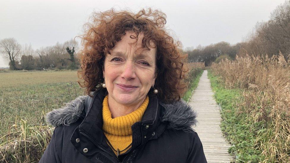 Catherine Linstrum on a marsh boardwalk