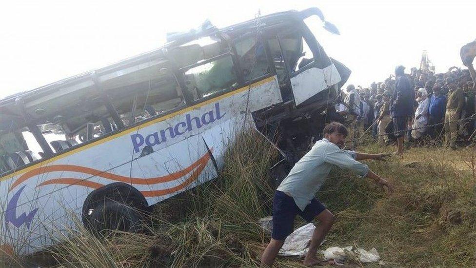 The scene of a bus accident in India's Rajasthan state, in which at least 32 people were killed, 23 December 2017