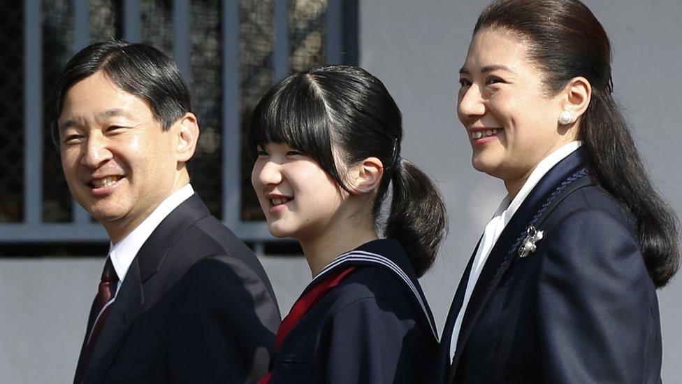 Japan's Princess Aiko (C) arrives with her parents Crown Prince Naruhito (L) and Crown Princess Masako to attend her graduation ceremony at the Gakushuin Primary School in Tokyo on 18 March 2014