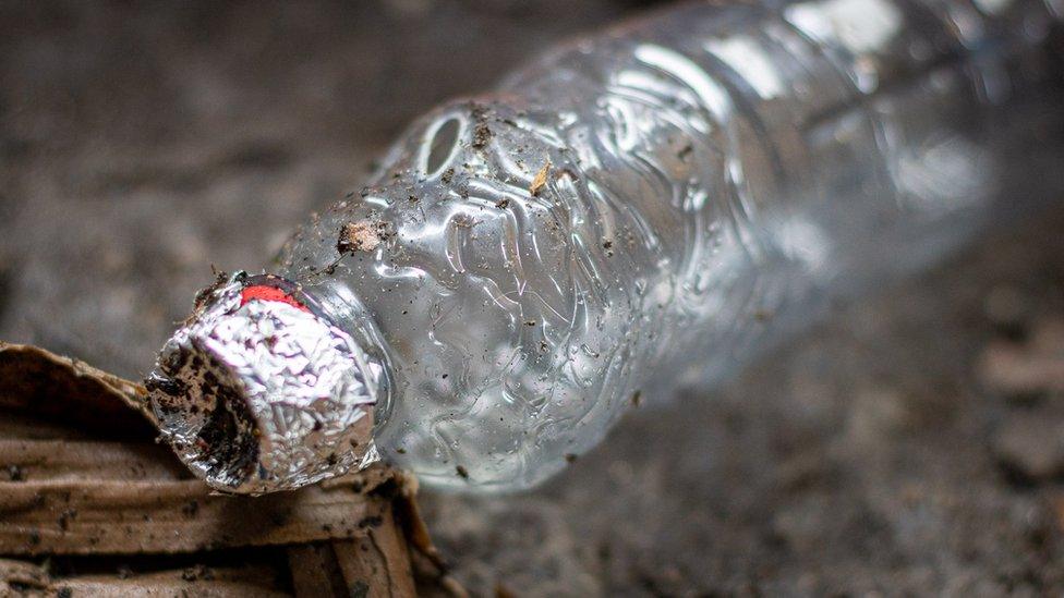 A bottle with foil on