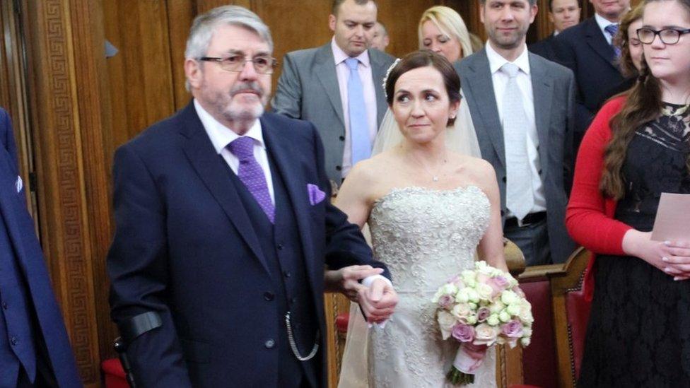 John Kendrick walking his daughter Nicky down the aisle