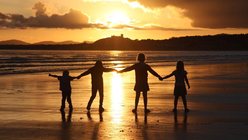 Alexandra Nash snapped her four children playing in the evening sun in view of Criccieth Castle