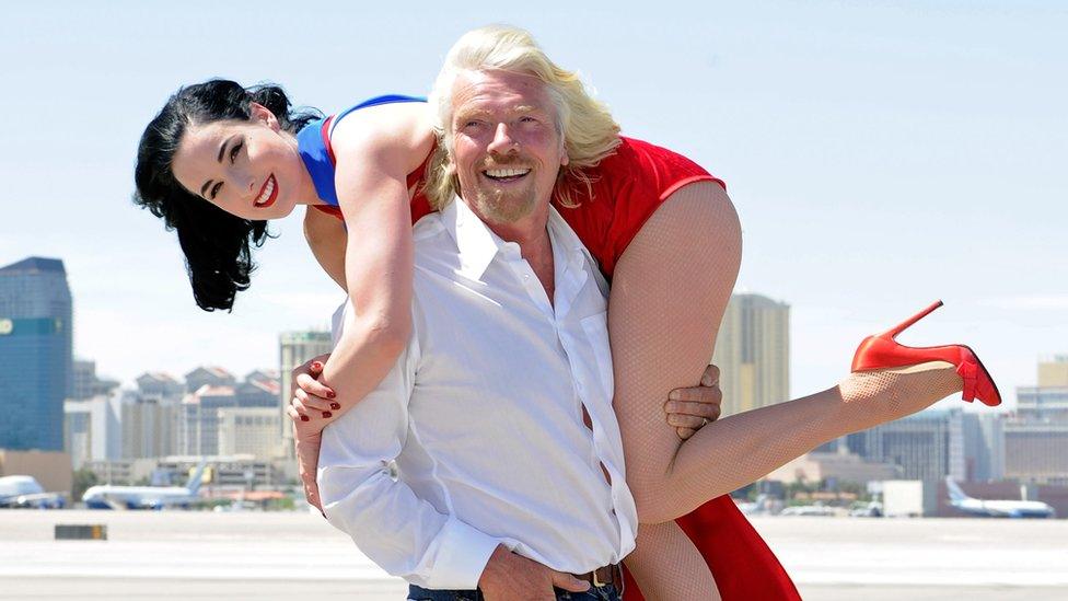 Founder and President of Virgin Group Sir Richard Branson holds burlesque artist Dita Von Teese on the tarmac at McCarran International Airport June 15, 2010 in Las Vegas, Nevada. Branson is celebrating Virgin Atlantic Airways' 10th anniversary of flying between London and Las Vegas.