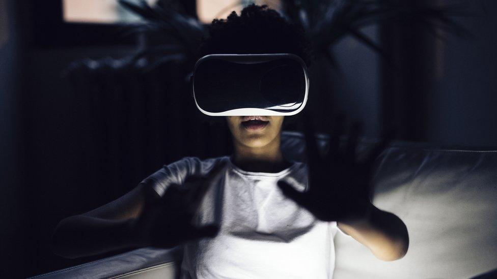 A stock image of a woman using VR