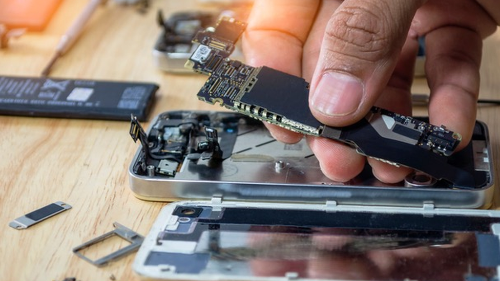 Person fixing a phone