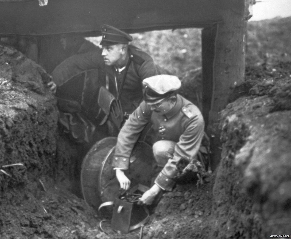 A German army officer preparing to detonate a mine placed in a tunnel under allied trenches in 1916