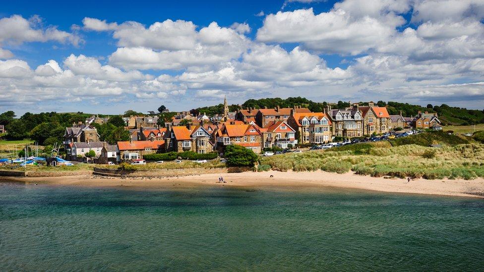 Aerial shot of sea, beach and houses at Alnmouth