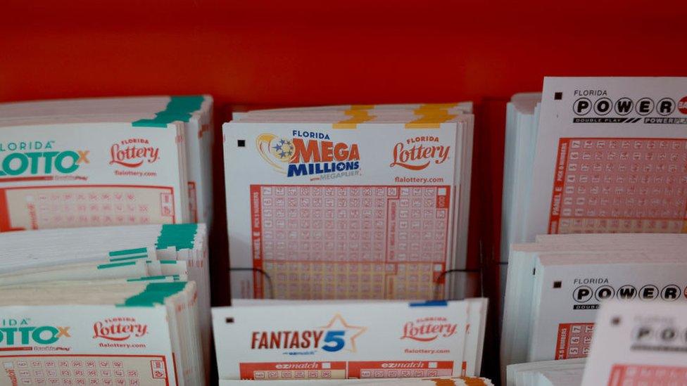 Mega Millions tickets displayed in a store