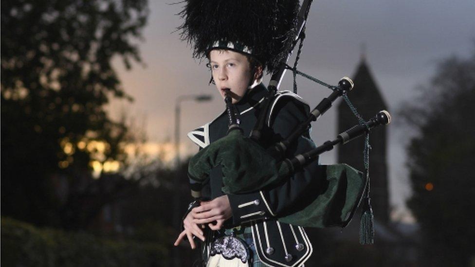 boy playing bagpipes