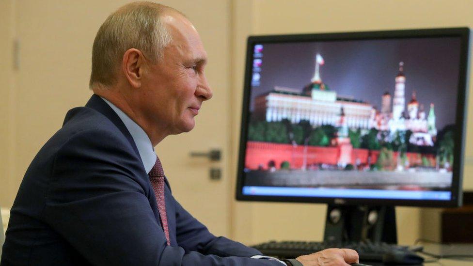 Russia's President Vladimir Putin during a video conference meeting with participants in the We Are Together nationwide volunteer campaign