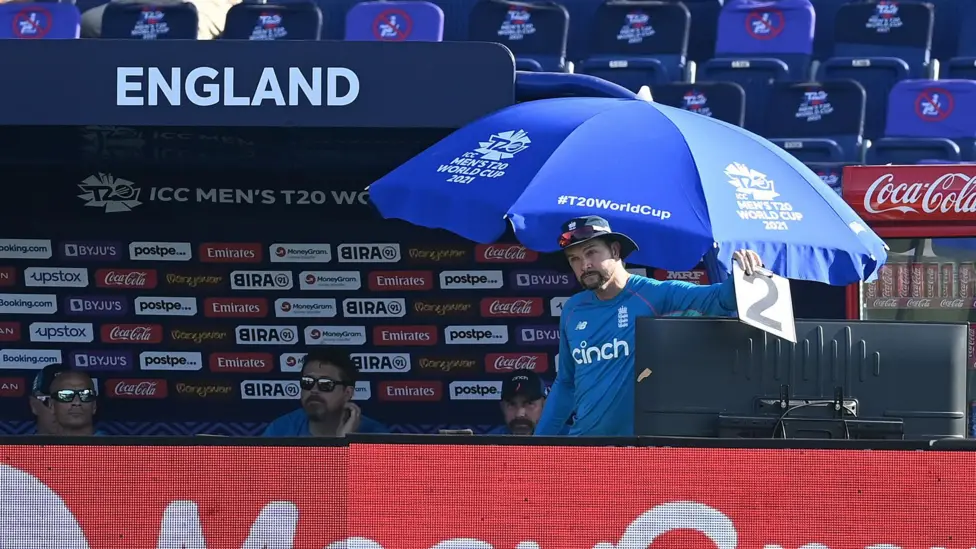 England's former analyst Nathan Leamon holds up card in coded message to captain Eoin Morgan