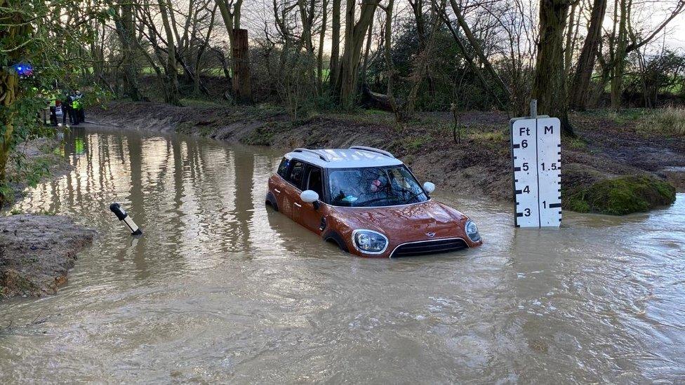 A Mini in deep flood water