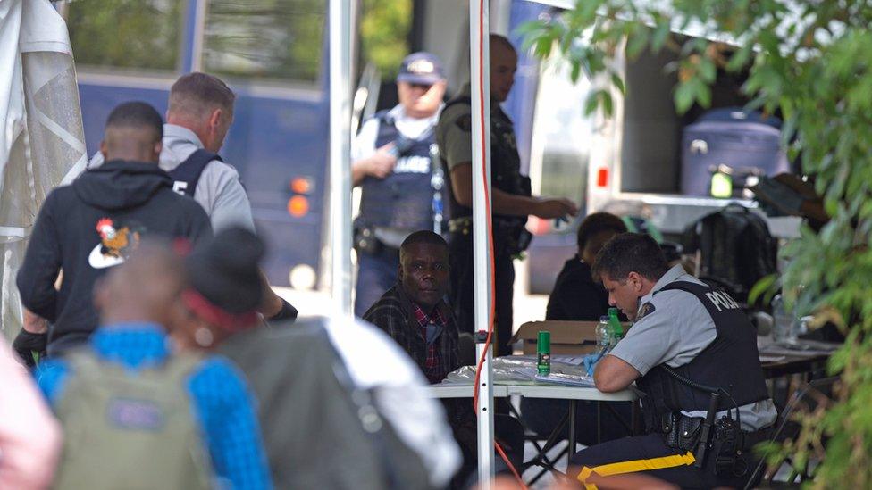 Asylum seekers being processed at the Quebec-US border