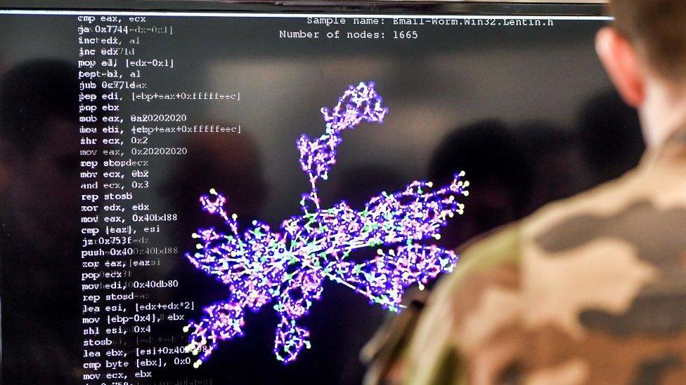 A member of the military specialised in cyber defence works on a computer during the 10th International Cybersecurity Forum in Lille on January 23, 2018