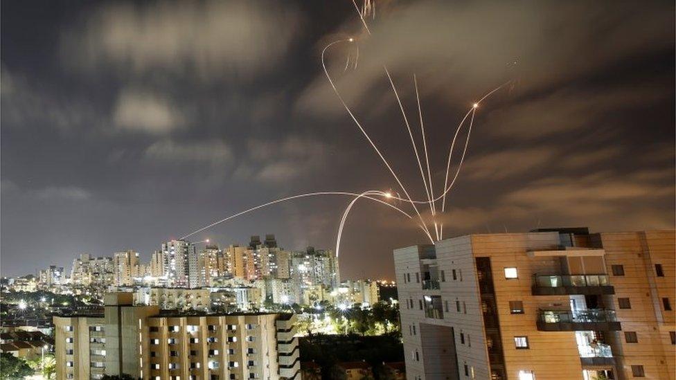 Streaks of light are seen as Israel's Iron Dome anti-missile system intercepts rockets launched from the Gaza Strip towards Israel, as seen from Ashkelon, Israel May 12, 2021.