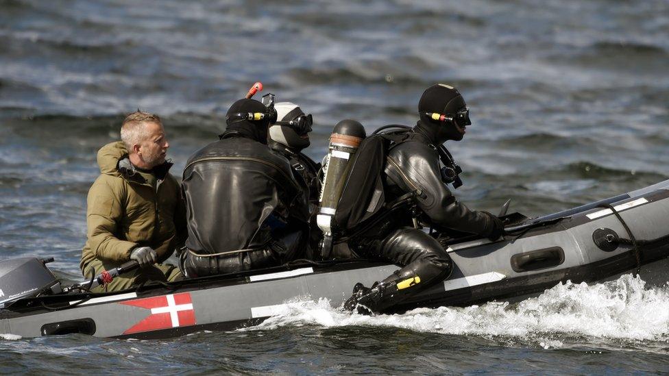 Divers from the Danish Defence Command preparing for a dive in Koge Bugt near Amager in Copenhagen on Tuesday after a woman's torso was found on Monday