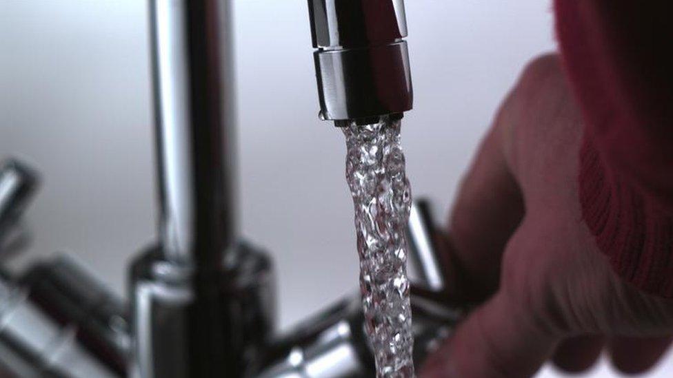 Water pouring from tap