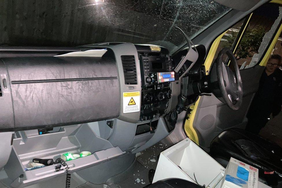 A smashed window (view from inside the cab of the ambulance)