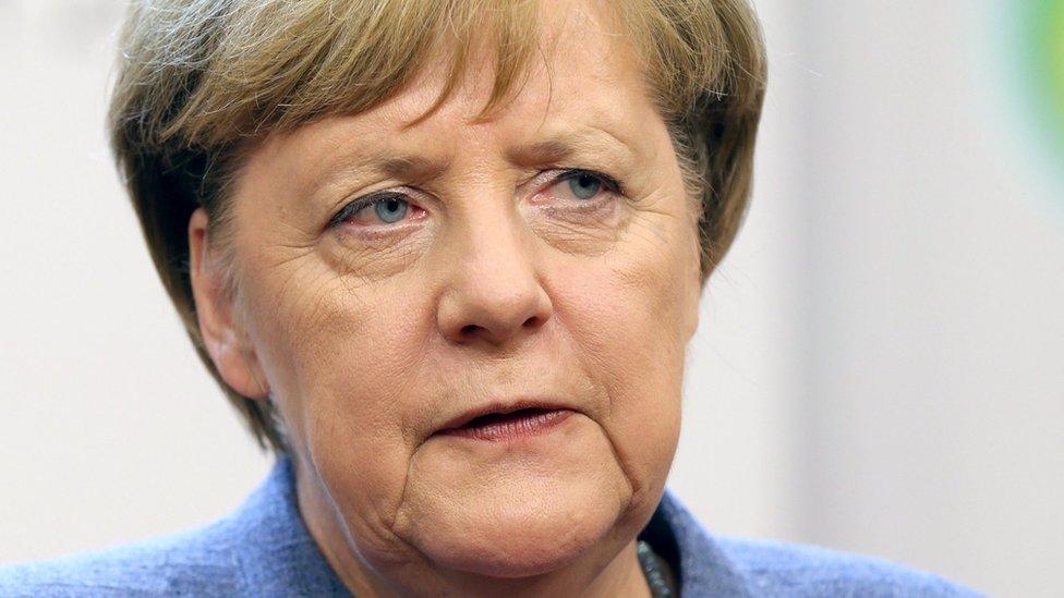 German acting Chancellor Angela Merkel gives a press conference during a EU summit in Brussels