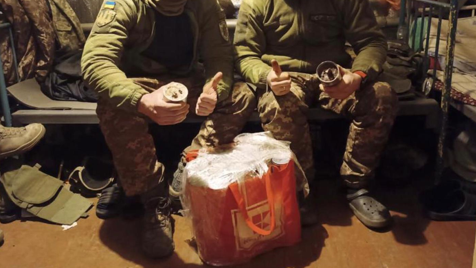 Soldiers in Ukraine with beeswax candles