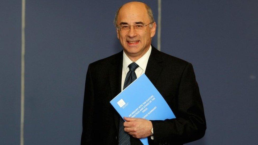 Lord Justice Leveson with his report